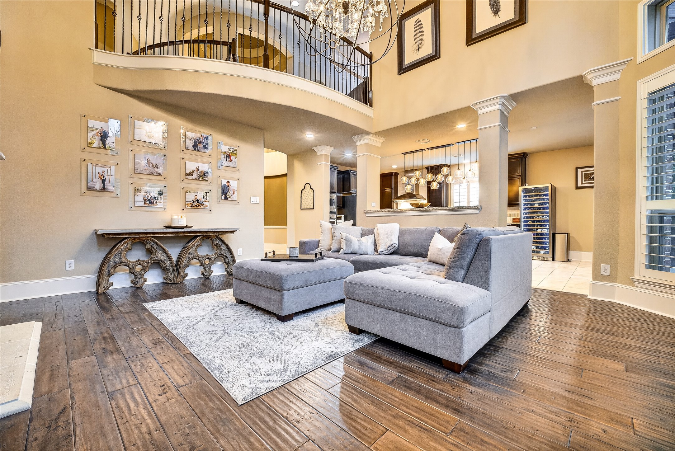 7907 Augusta Creek Court Spring, TX 77389 - Photo 20 of 49 This spacious living room features 2 story high ceilings, and the exposed upstairs catwalk. An upstairs balcony overlooks the space, enhancing the room's grandeur.