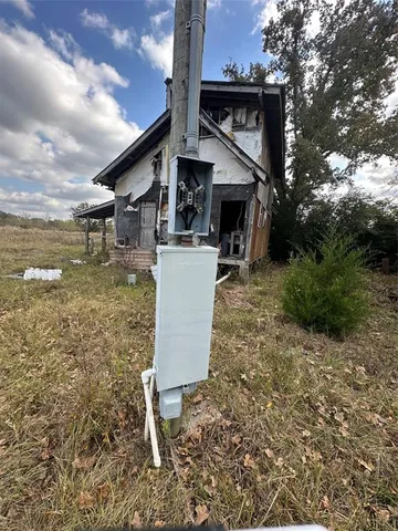 a view of a tree in a yard