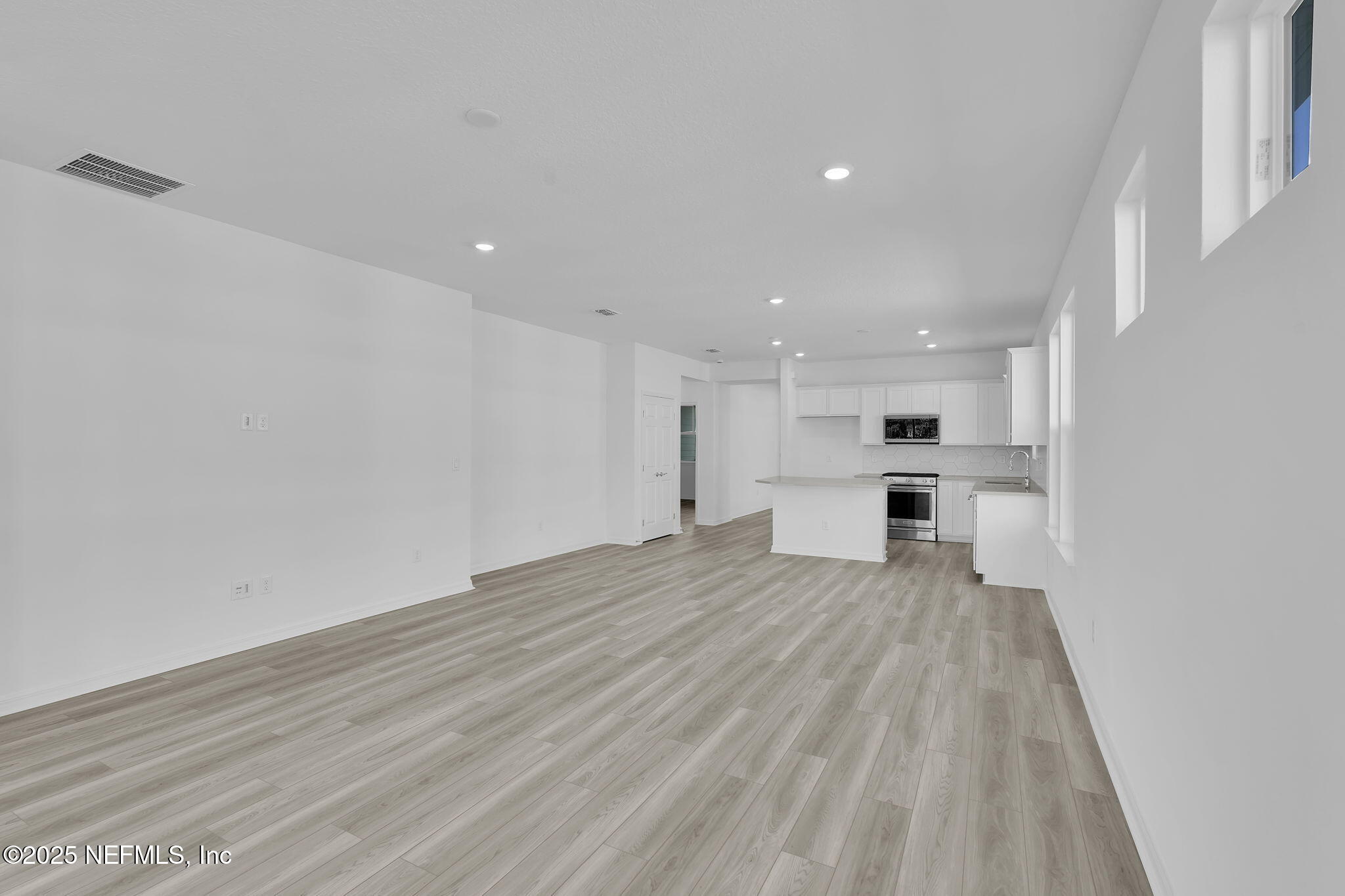 269 Ecliptic Loop Yulee, FL 32097 - Photo 13 of 44 a view of kitchen with wooden floor