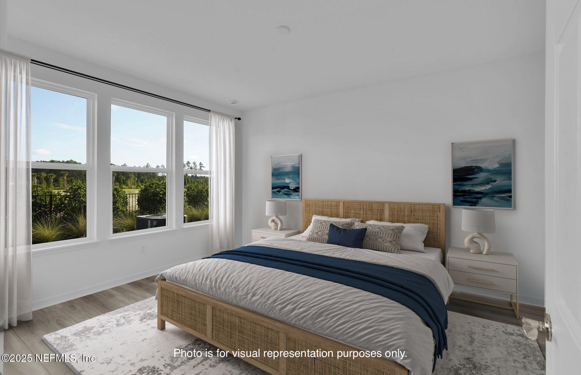 269 Ecliptic Loop Yulee, FL 32097 - Photo 15 of 44 a bedroom with a large bed and a window