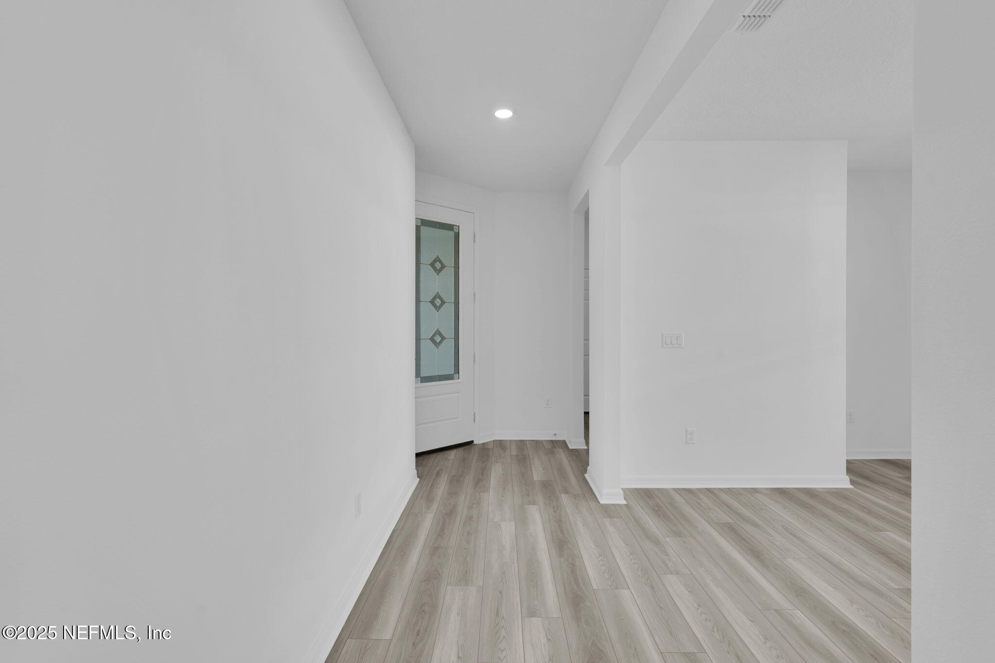 269 Ecliptic Loop Yulee, FL 32097 - Photo 3 of 44 a view of a room with wooden floor