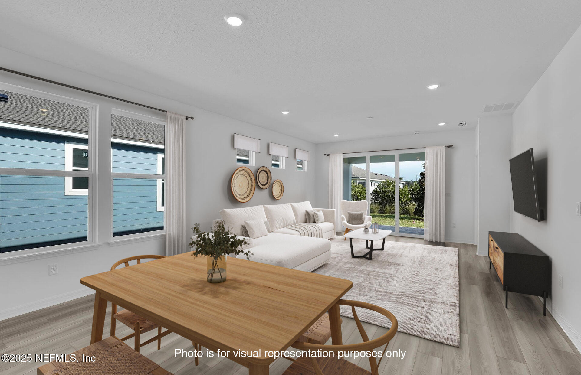 269 Ecliptic Loop Yulee, FL 32097 - Photo 9 of 44 a living room with furniture a flat screen tv and a large window