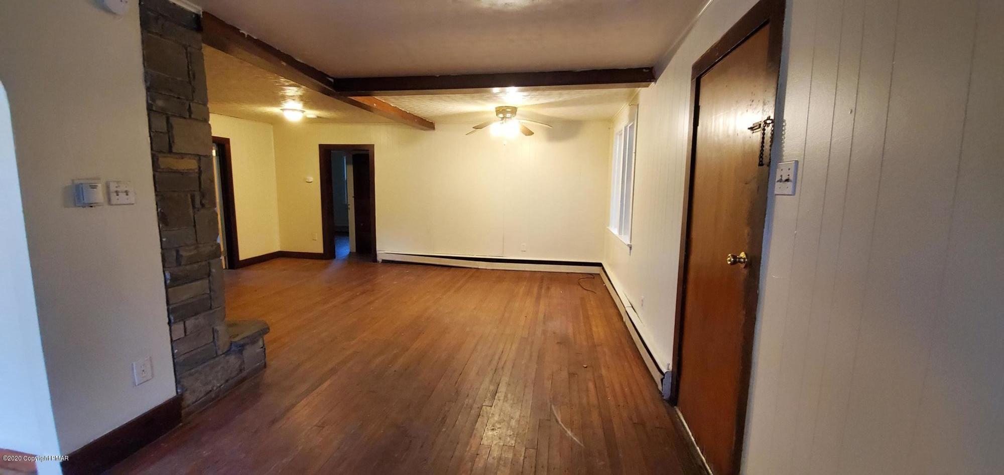 4132 Norton Pryor Road Pocono Summit, PA 18346 - Photo 26 of 36 a view of a hallway with wooden floor