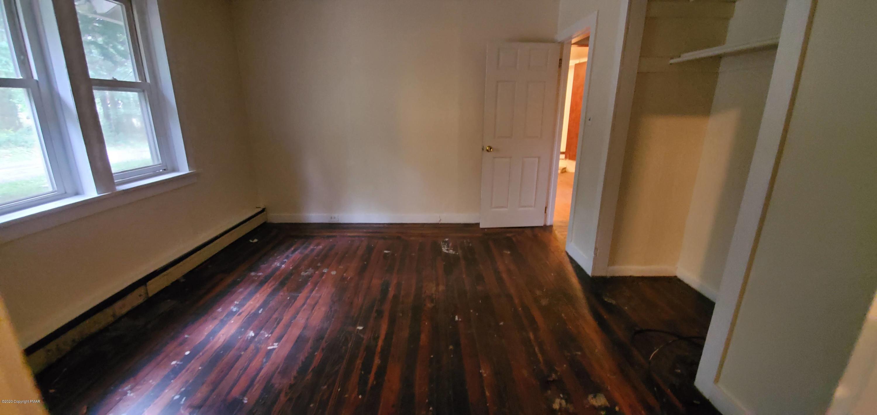 4132 Norton Pryor Road Pocono Summit, PA 18346 - Photo 36 of 36 a view of a room with wooden floor and staircase
