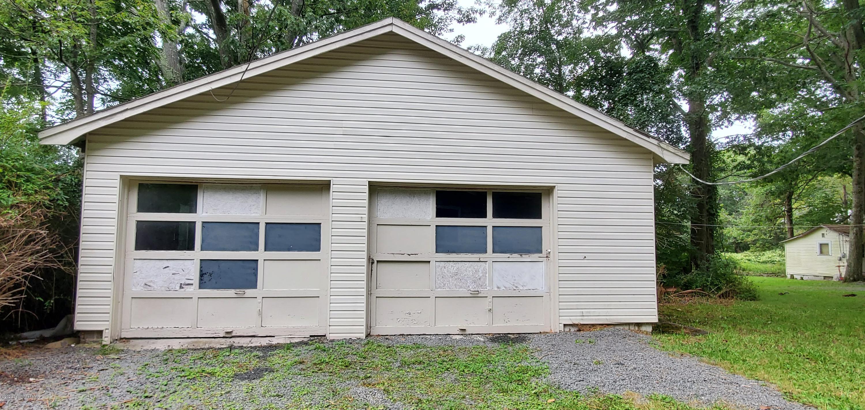 4132 Norton Pryor Road Pocono Summit, PA 18346 - Photo 5 of 36 a view of a house with a yard