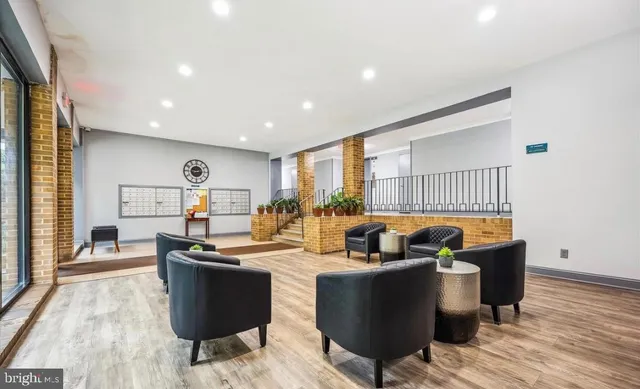 a view of gallery with wooden floor