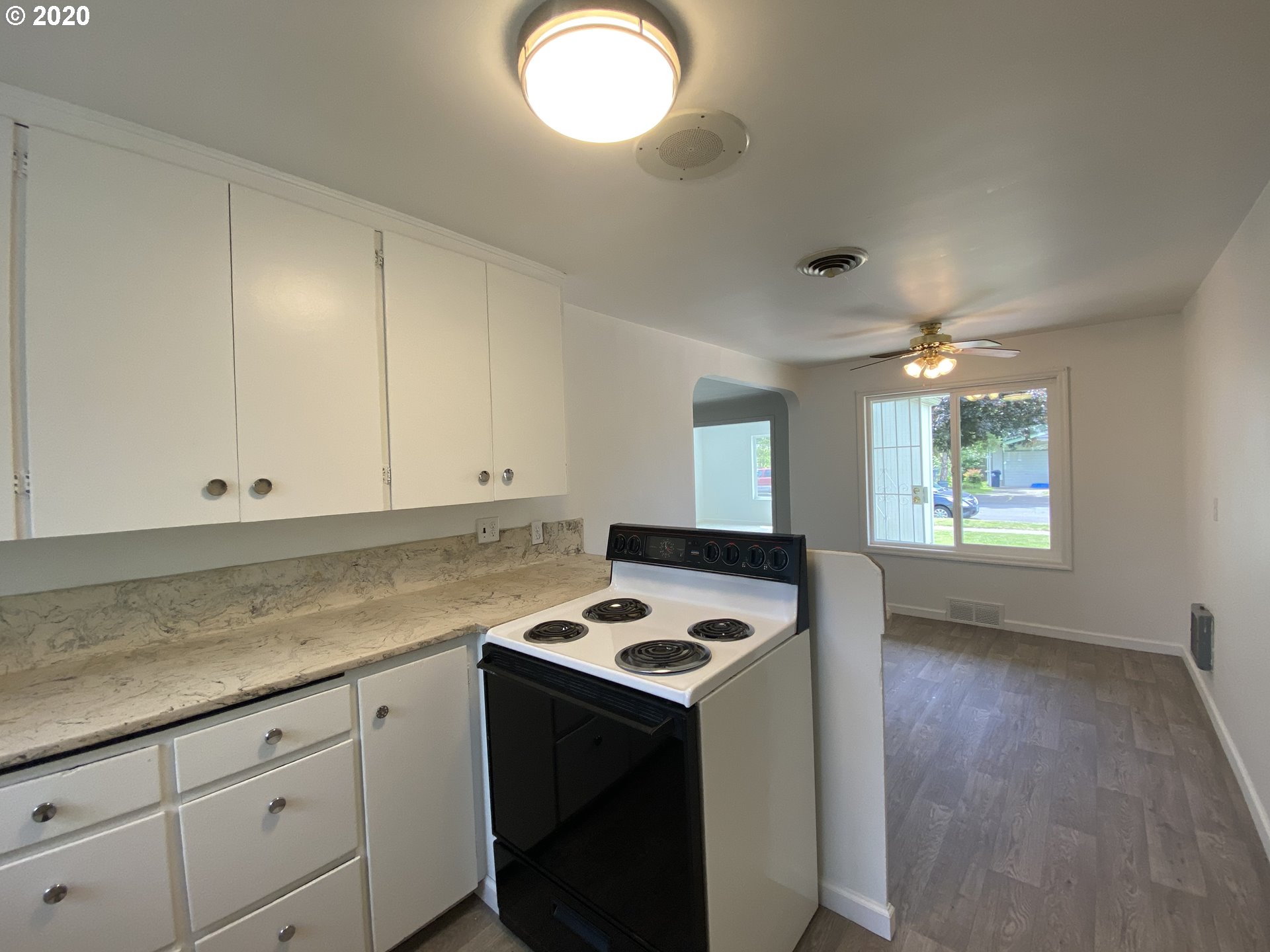 830 L Street Springfield, OR 97477 - Photo 10 of 24 a kitchen that has a sink and a stove