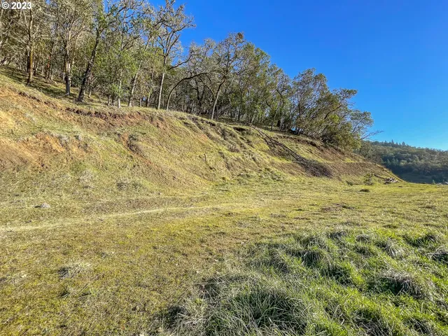 a view of empty space with wooden fence