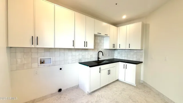 a view of a kitchen cabinets and wooden floor