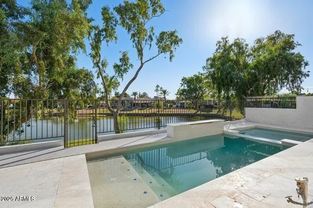 a view of a backyard with a small pool