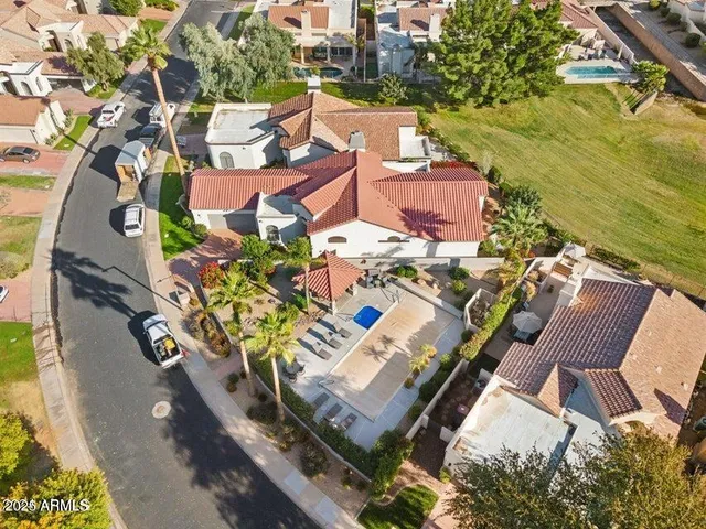 an aerial view of residential houses with outdoor space
