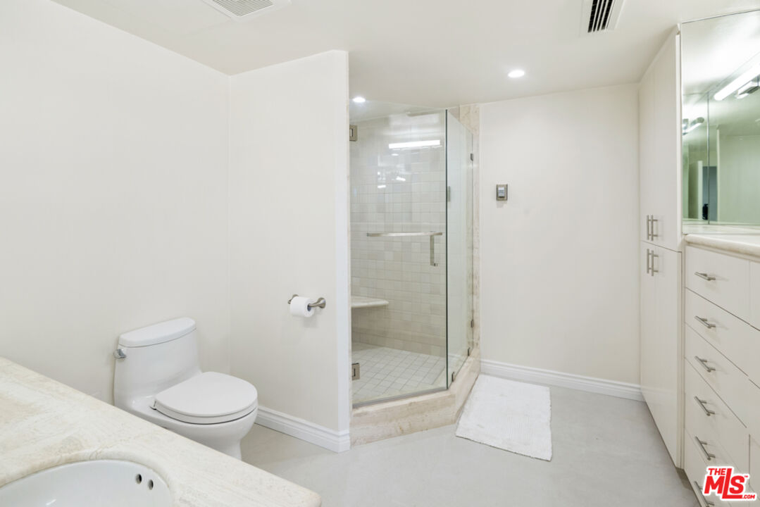 865 Comstock Avenue, Unit 10D/E Los Angeles, CA 90024 - Photo 41 of 49 a bathroom with a toilet a sink and shower