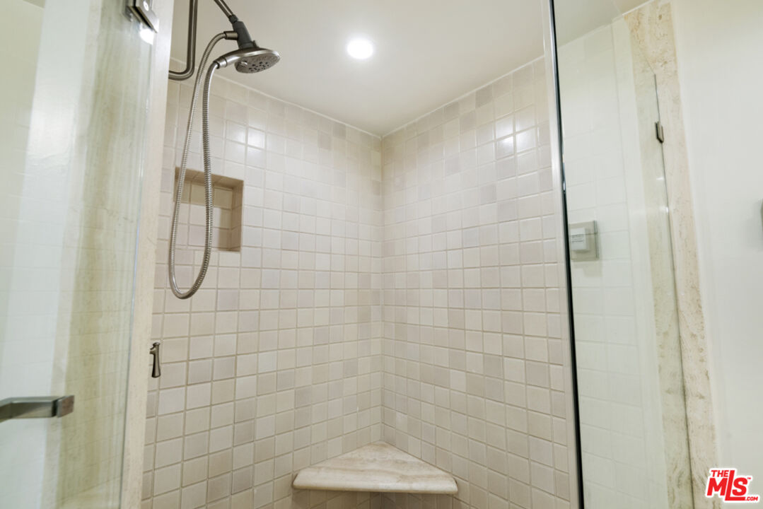 865 Comstock Avenue, Unit 10D/E Los Angeles, CA 90024 - Photo 43 of 49 a bathroom with a shower