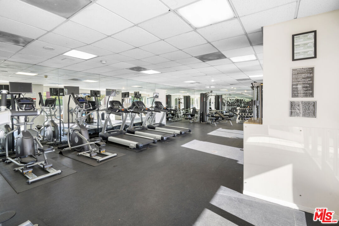 865 Comstock Avenue, Unit 10D/E Los Angeles, CA 90024 - Photo 47 of 49 a view of a room with gym equipment