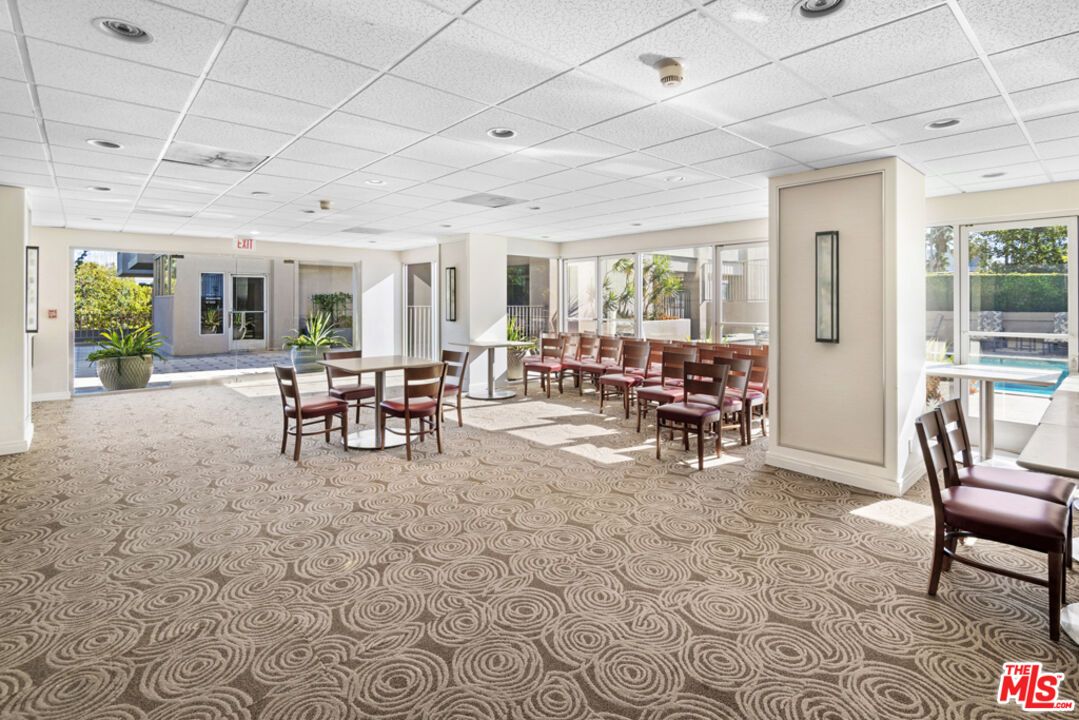 865 Comstock Avenue, Unit 10D/E Los Angeles, CA 90024 - Photo 48 of 49 a view of a livingroom with furniture wooden floor and a rug