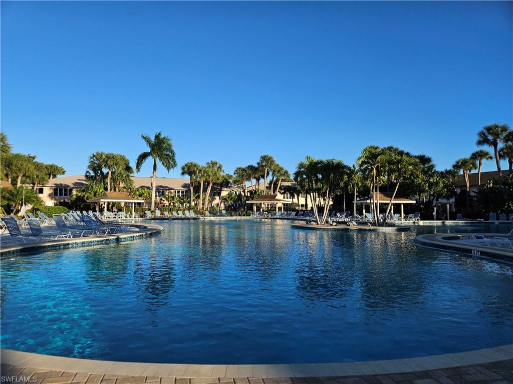 4120 Looking Glass Lane, Unit 3708 Naples, FL 34112 - Photo 1 of 25 View of pool with a water view