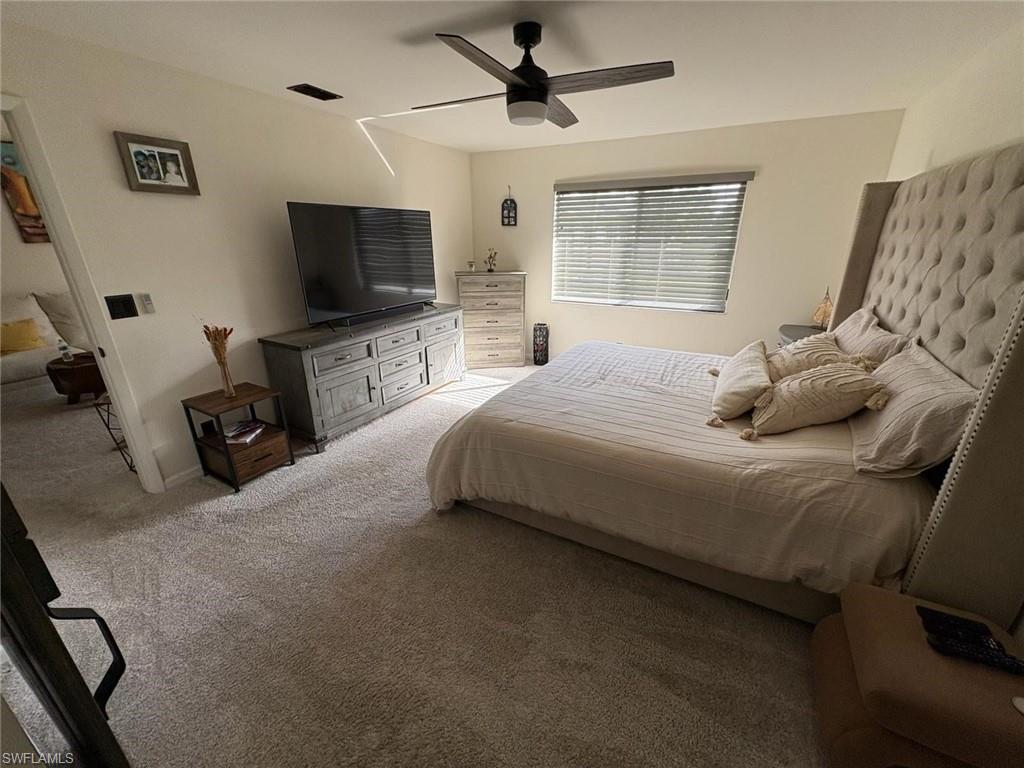 4120 Looking Glass Lane, Unit 3708 Naples, FL 34112 - Photo 16 of 25 Bedroom with carpet and ceiling fan