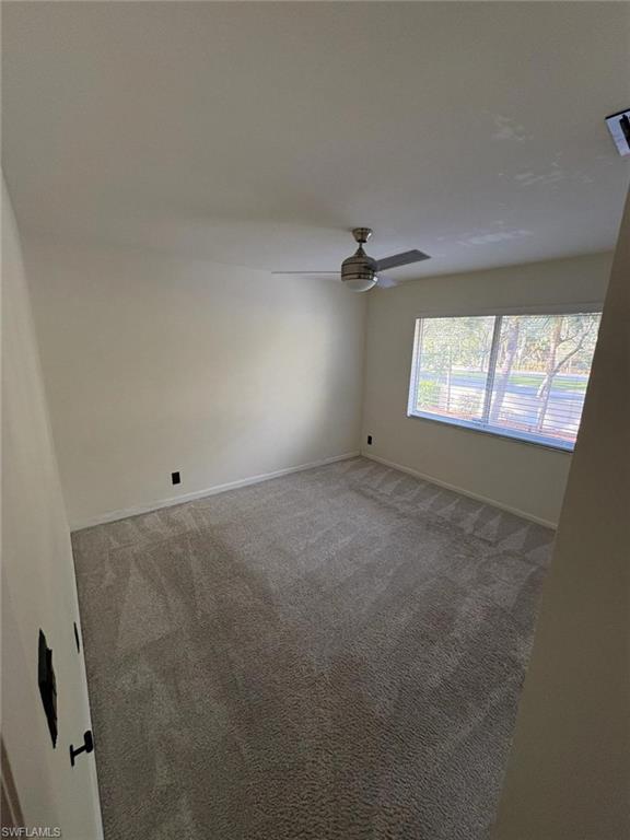 4120 Looking Glass Lane, Unit 3708 Naples, FL 34112 - Photo 20 of 25 Spare room featuring carpet flooring and ceiling fan