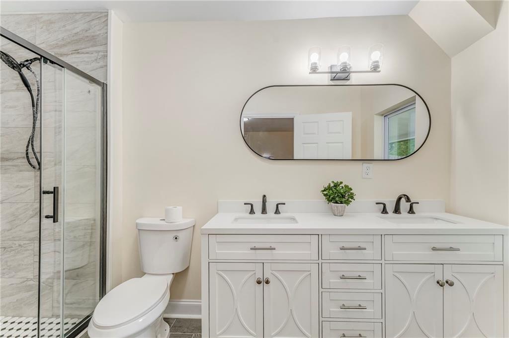 310 Kingston Avenue Northeast Rome, GA 30161 - Photo 12 of 45 a bathroom with a toilet sink and mirror