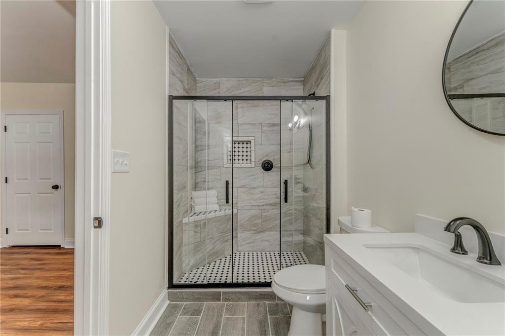 310 Kingston Avenue Northeast Rome, GA 30161 - Photo 13 of 45 a bathroom with a sink toilet and shower