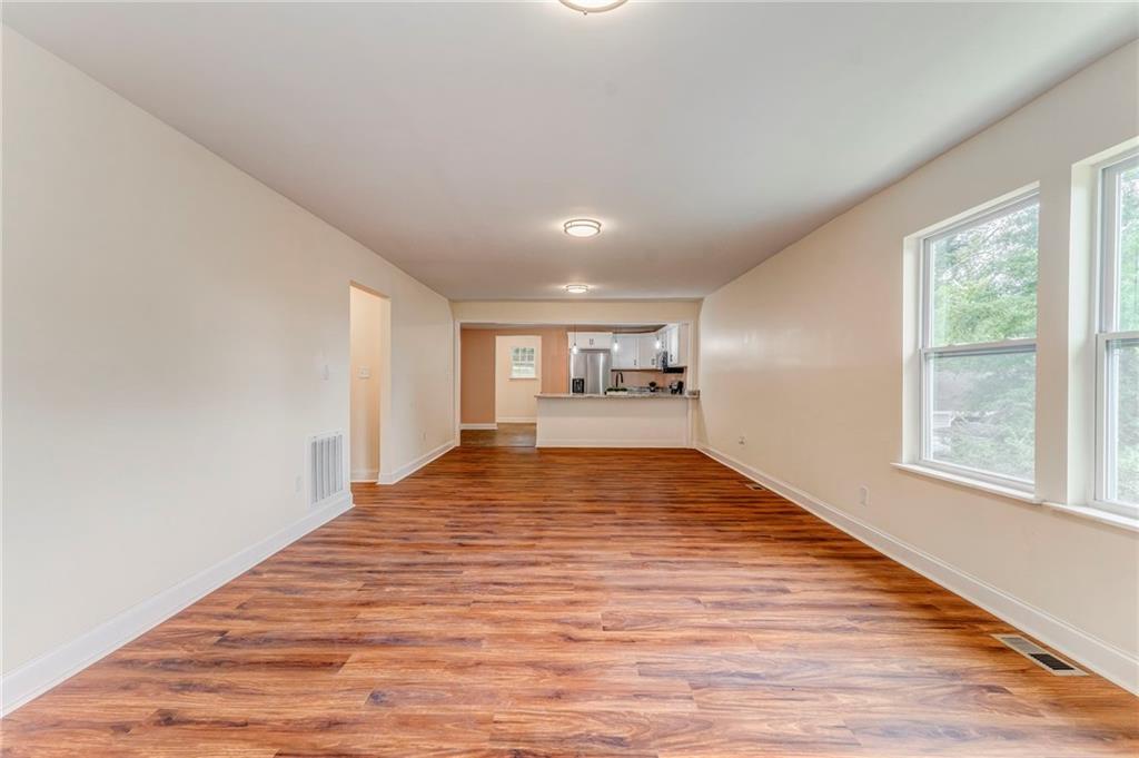 310 Kingston Avenue Northeast Rome, GA 30161 - Photo 20 of 45 a view of empty room with wooden floor and fan