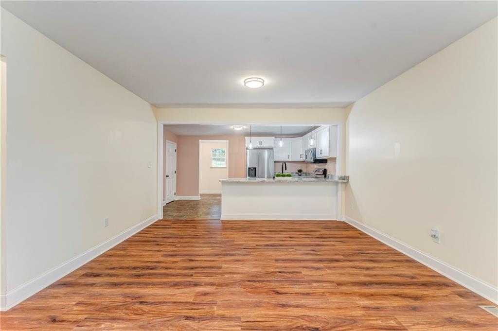 310 Kingston Avenue Northeast Rome, GA 30161 - Photo 22 of 45 a view of kitchen and hall with wooden floor