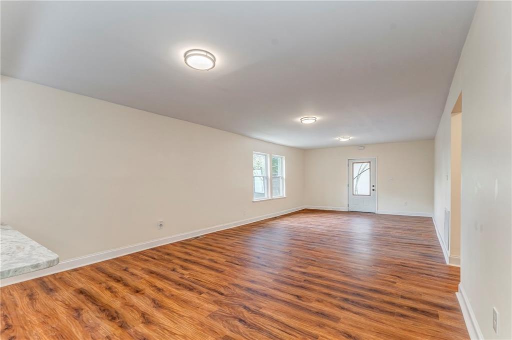 310 Kingston Avenue Northeast Rome, GA 30161 - Photo 24 of 45 a view of empty room with wooden floor and fan