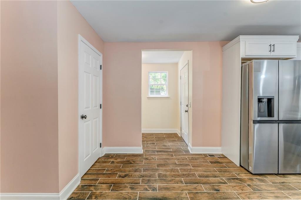 310 Kingston Avenue Northeast Rome, GA 30161 - Photo 30 of 45 a view of a refrigerator in kitchen and wooden floor