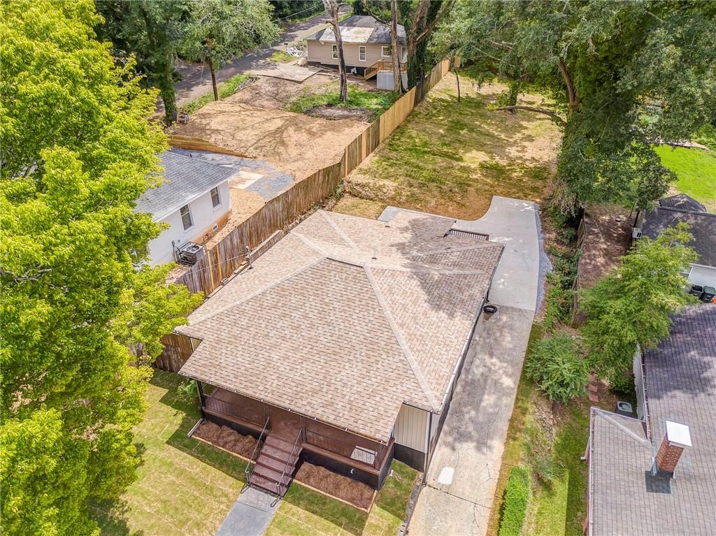 310 Kingston Avenue Northeast Rome, GA 30161 - Photo 3 of 45 an aerial view of a house with swimming pool and large trees