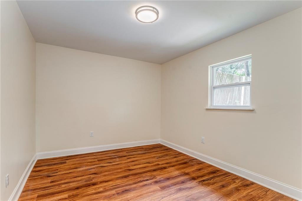 310 Kingston Avenue Northeast Rome, GA 30161 - Photo 33 of 45 an empty room with wooden floor and windows