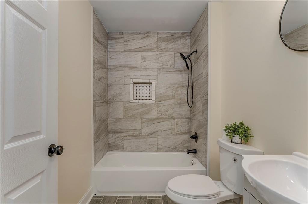 310 Kingston Avenue Northeast Rome, GA 30161 - Photo 36 of 45 a bathroom with a toilet and a shower