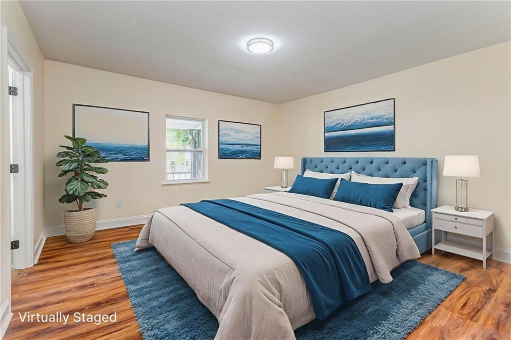 310 Kingston Avenue Northeast Rome, GA 30161 - Photo 9 of 45 a bedroom with bed and lamps