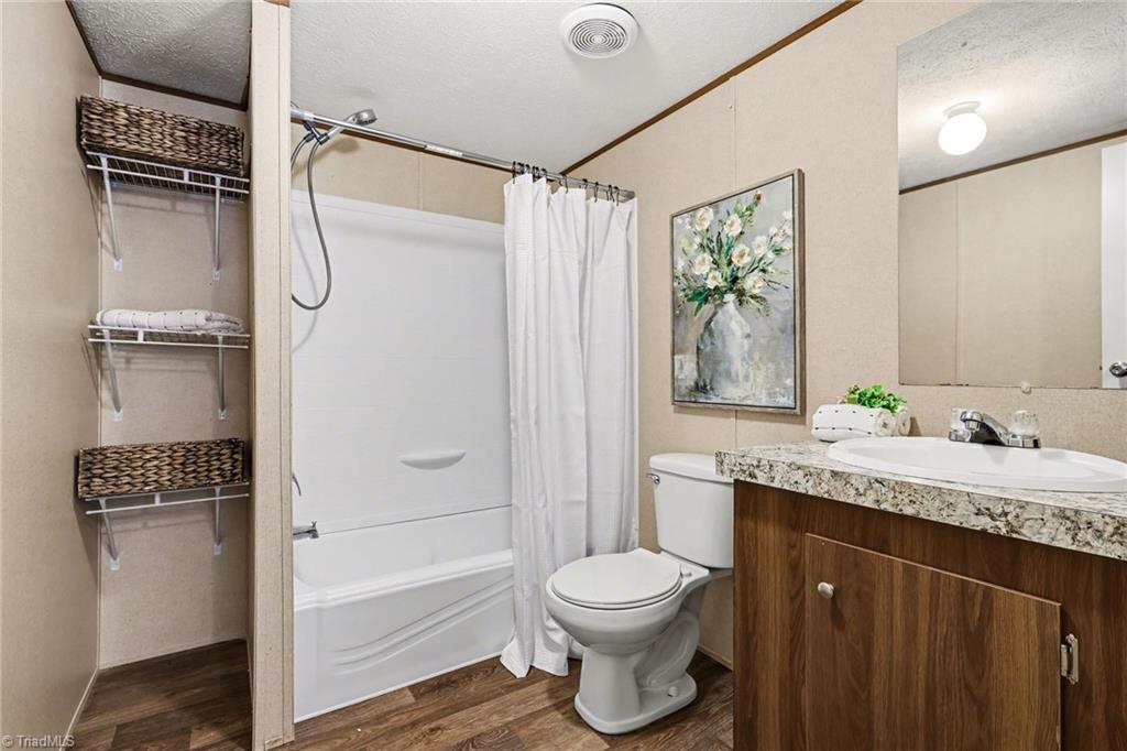 5061 Reid Road Winston-Salem, NC 27107 - Photo 21 of 39 Hall Bath with shelving for towels and linens