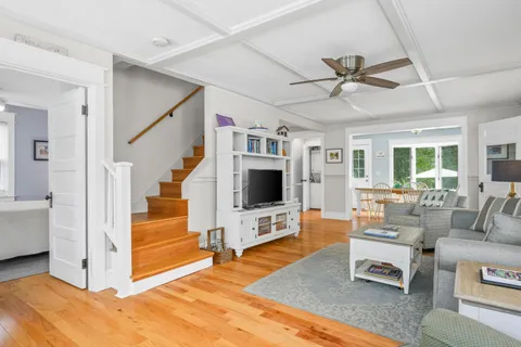 a view of a dining room with furniture and a window