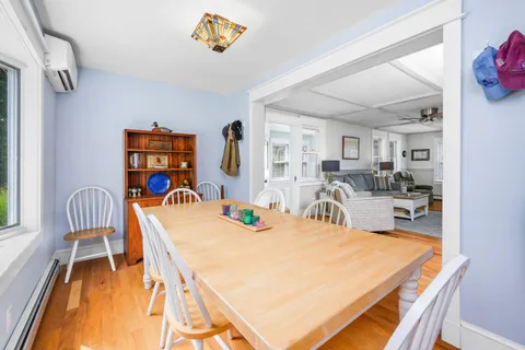 a view of a dining room with furniture window and outside view
