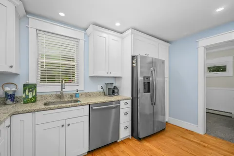 a bed room with a bed and a chair