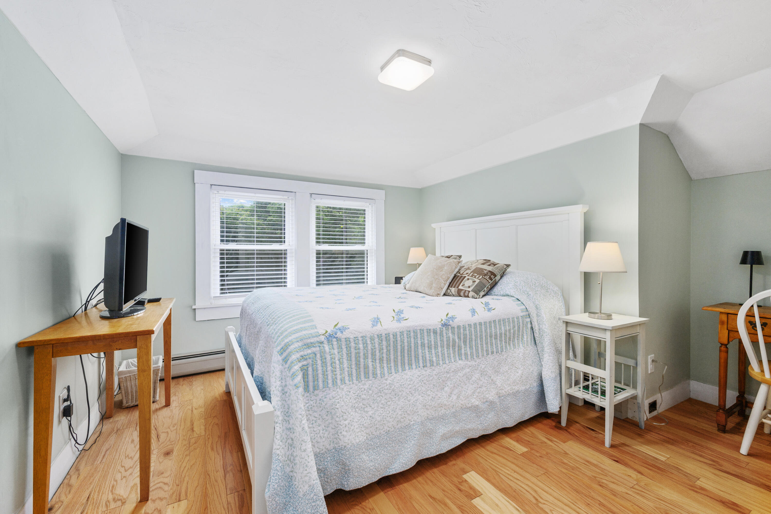 79 Forest Beach Road South Chatham, MA 02659 - Photo 26 of 60 a bedroom with a bed and a flat tv screen on the dresser