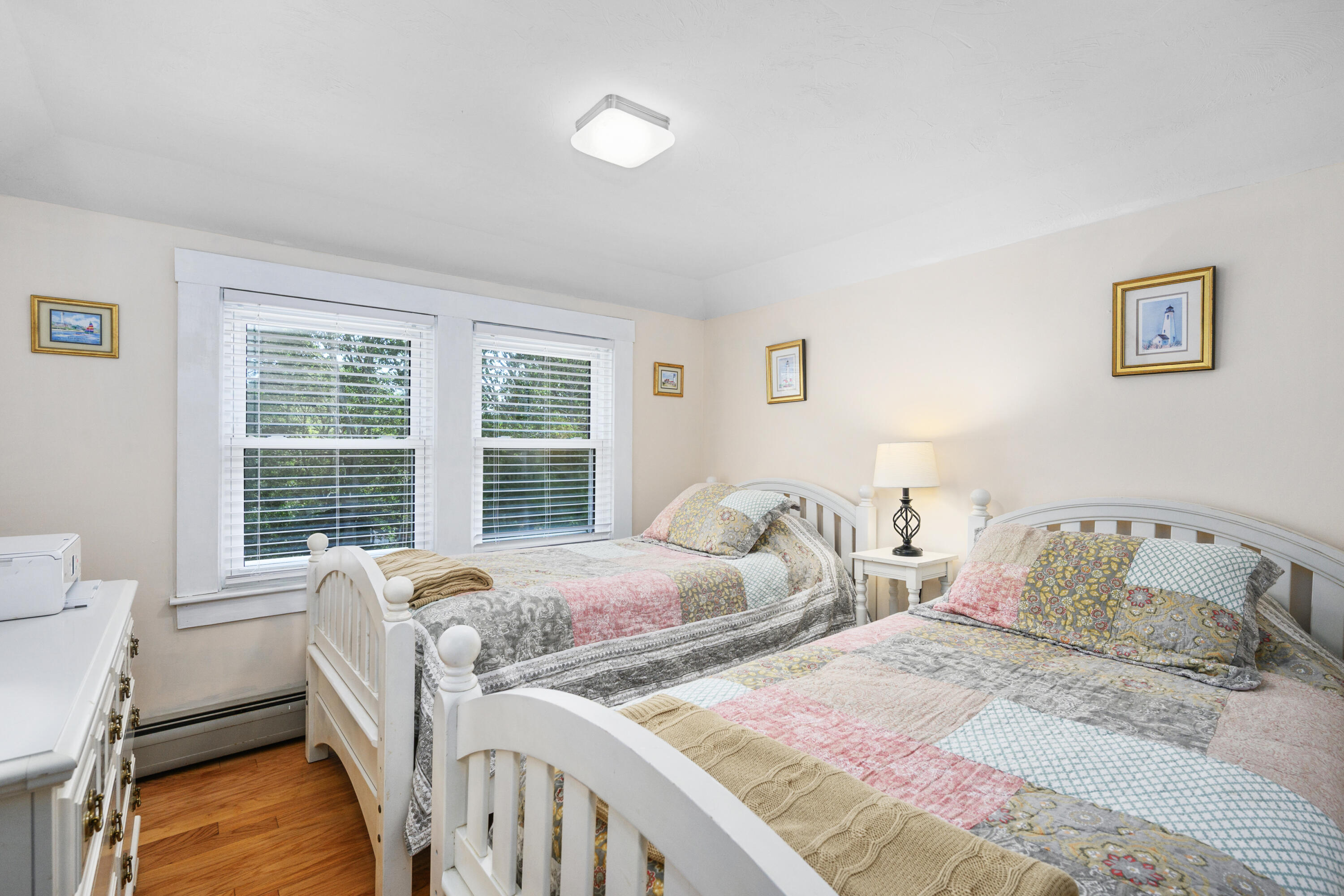 79 Forest Beach Road South Chatham, MA 02659 - Photo 29 of 60 a bedroom with two beds and a large window