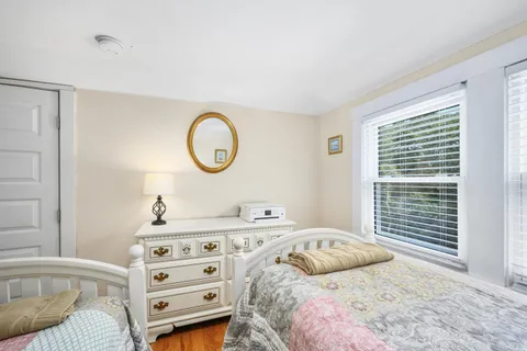 a bathroom with a sink a toilet and shower curtain