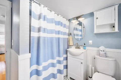 a front view of a house with a yard table and chairs