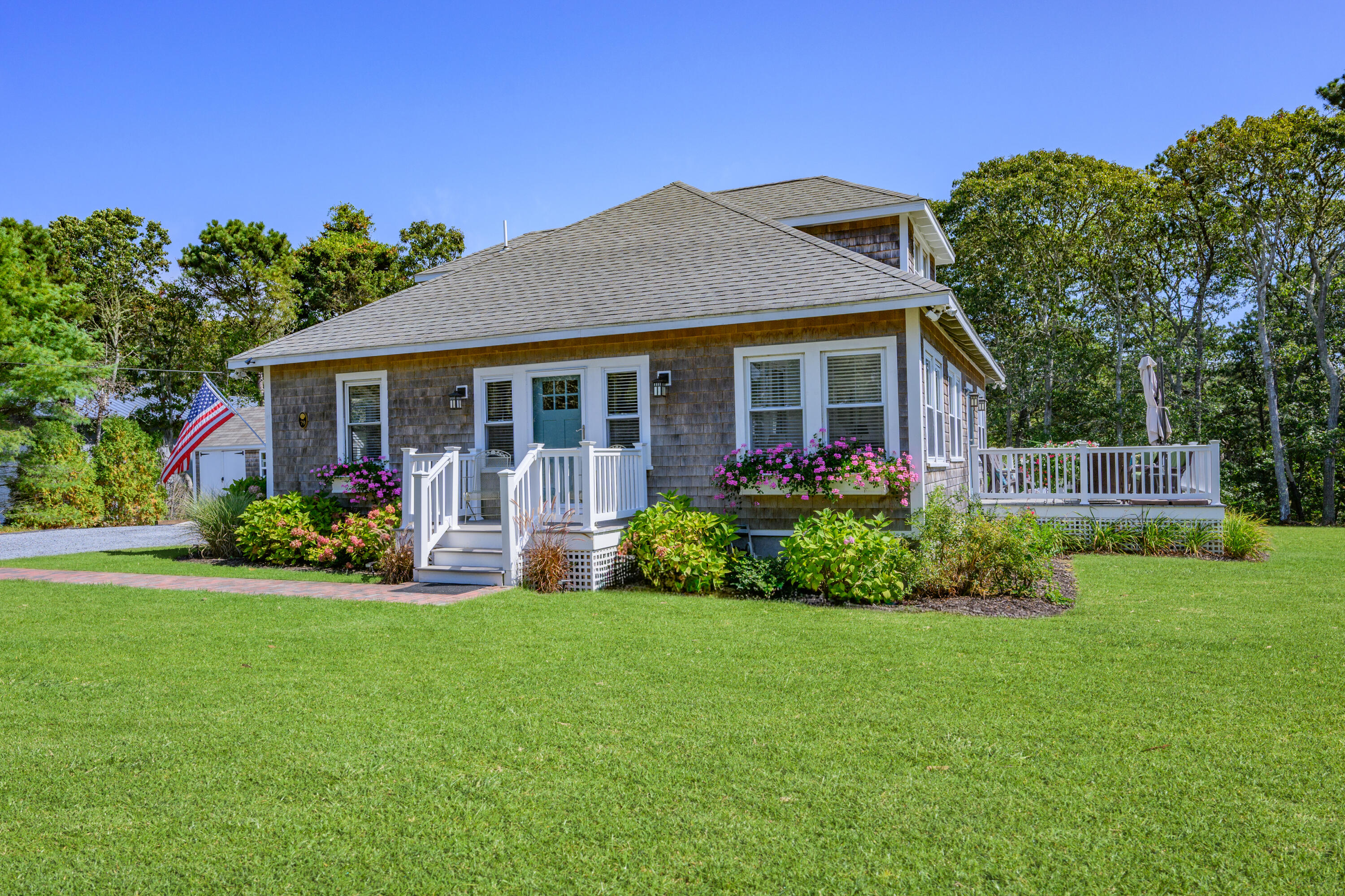 79 Forest Beach Road South Chatham, MA 02659 - Photo 33 of 60 a view of a house with a yard and potted plants