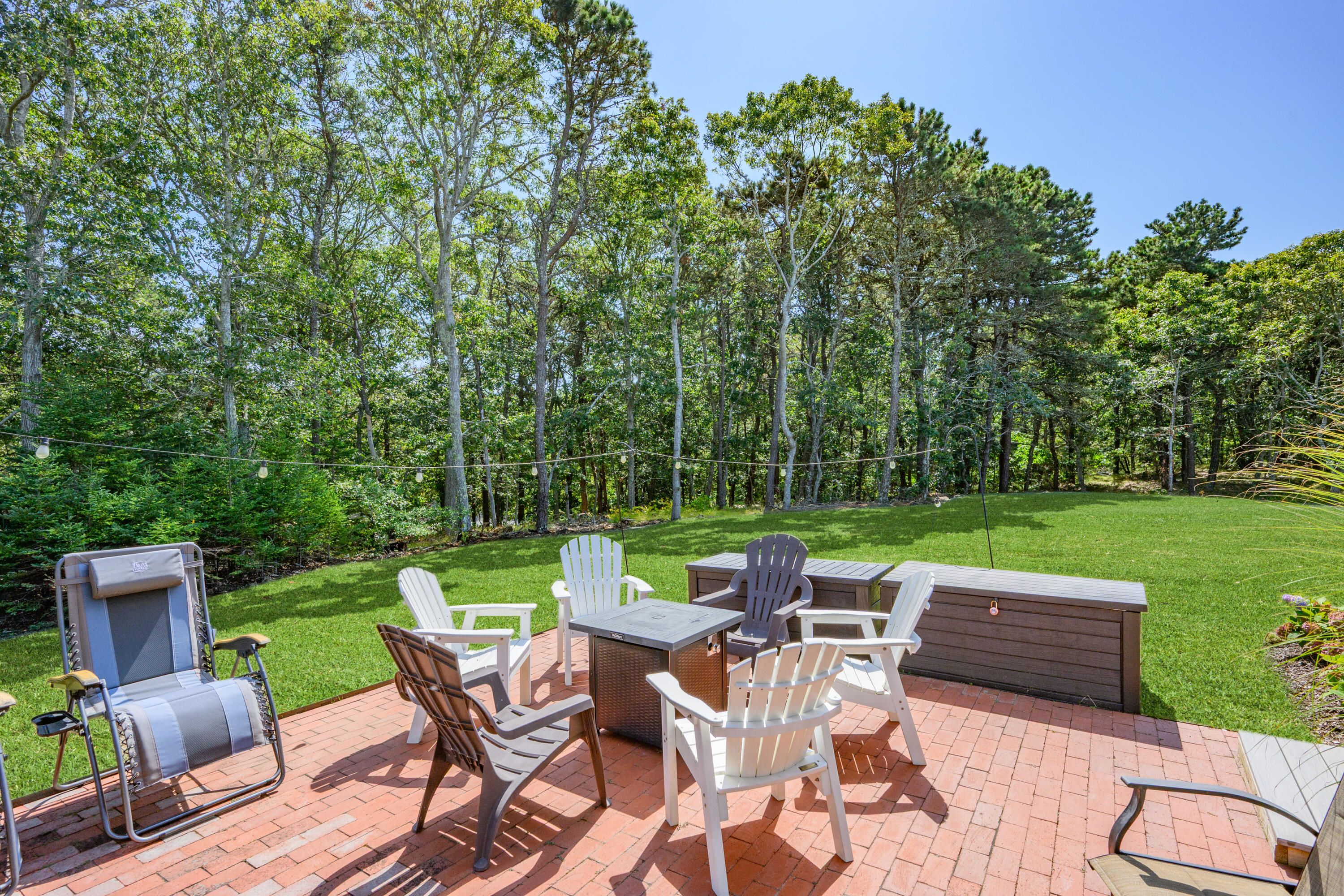 79 Forest Beach Road South Chatham, MA 02659 - Photo 38 of 60 a view of a chairs and table in the yard