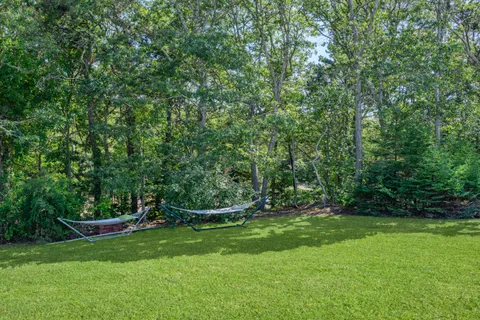 an aerial view of a houses with a yard