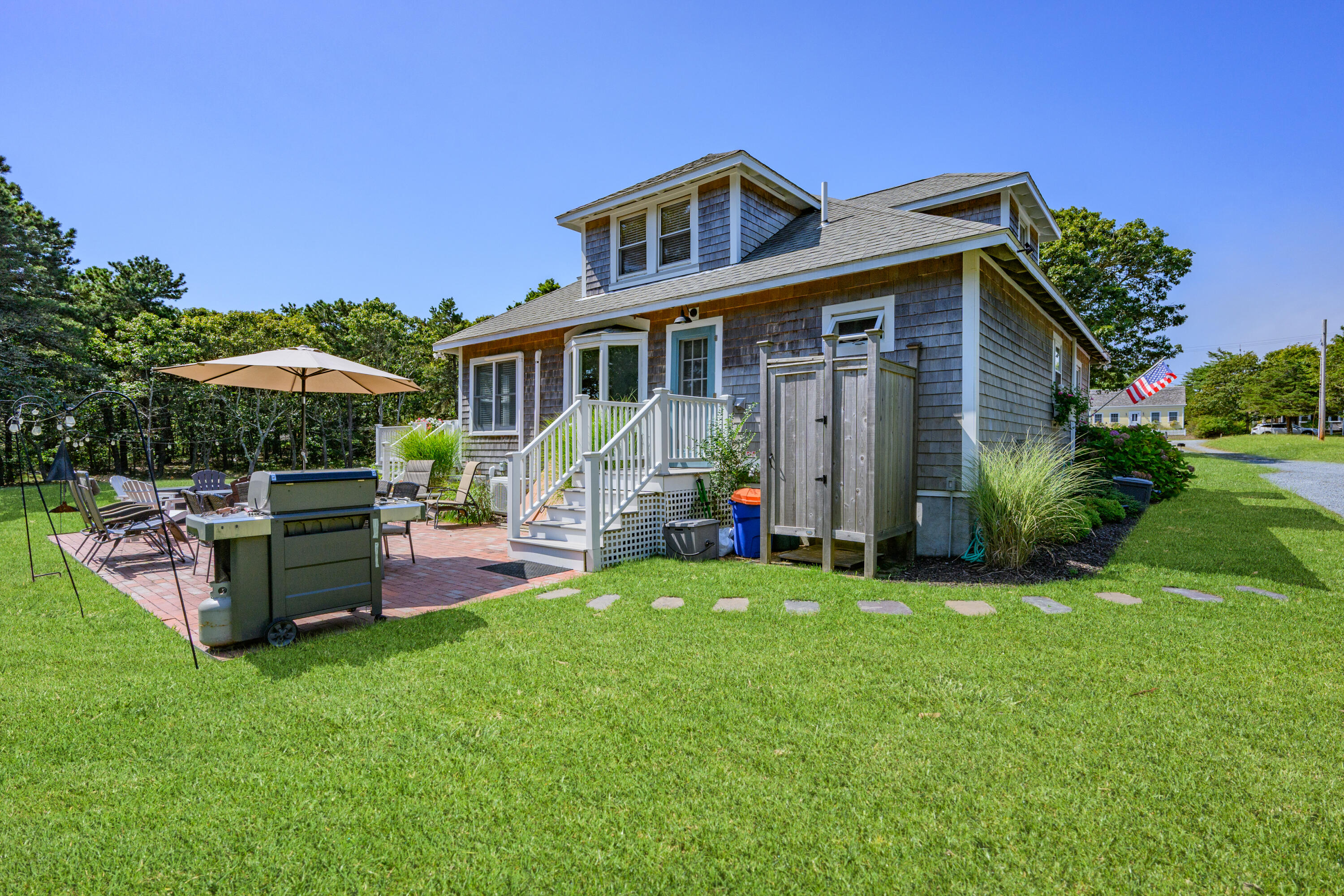 79 Forest Beach Road South Chatham, MA 02659 - Photo 46 of 60 a view of a house with a yard and sitting area