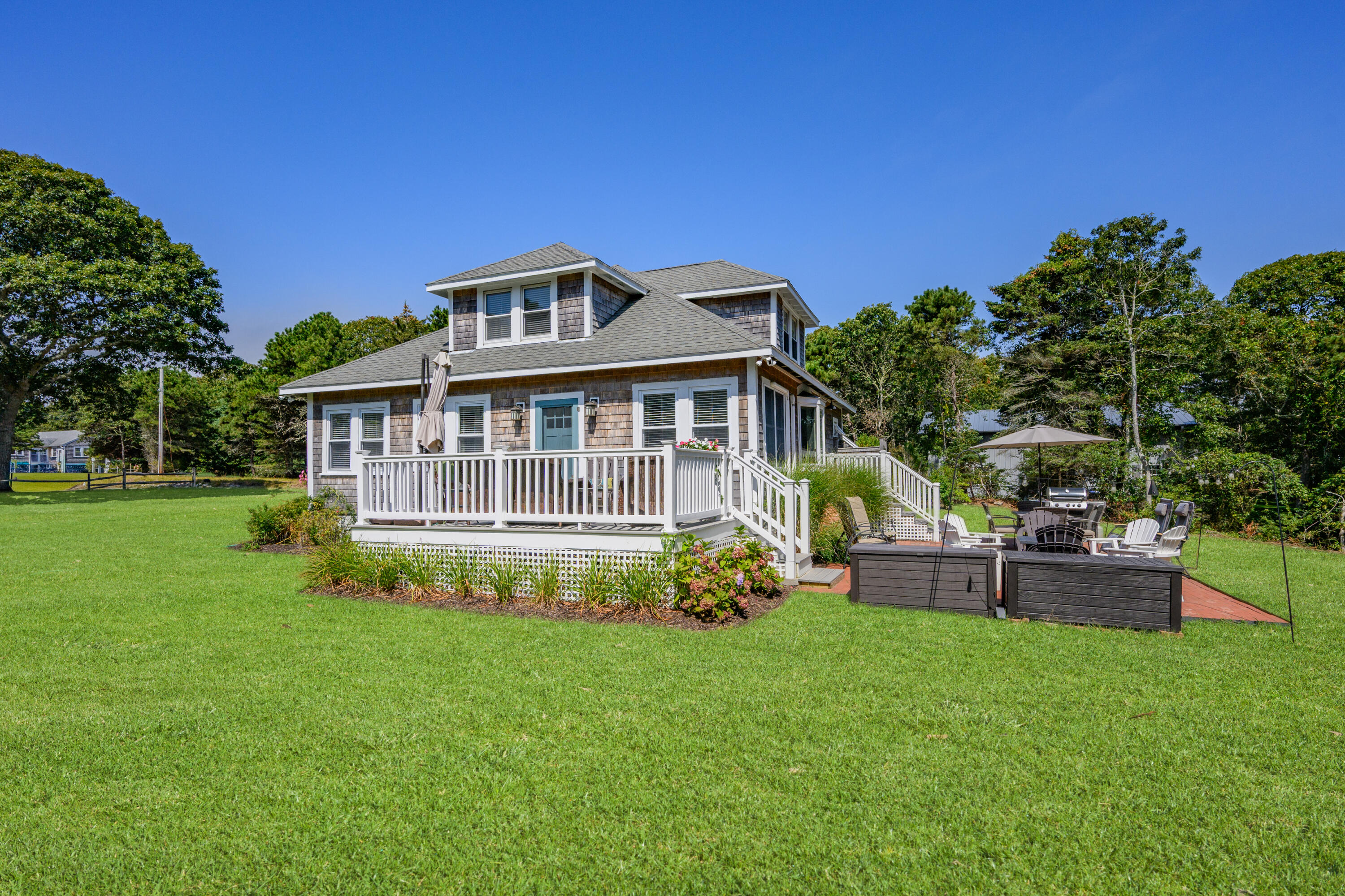 79 Forest Beach Road South Chatham, MA 02659 - Photo 47 of 60 a view of a house with a big yard plants and large trees
