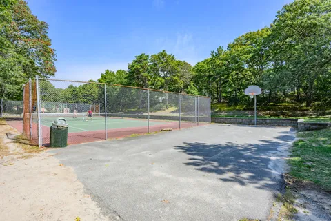an aerial view of a house with a yard and lake view