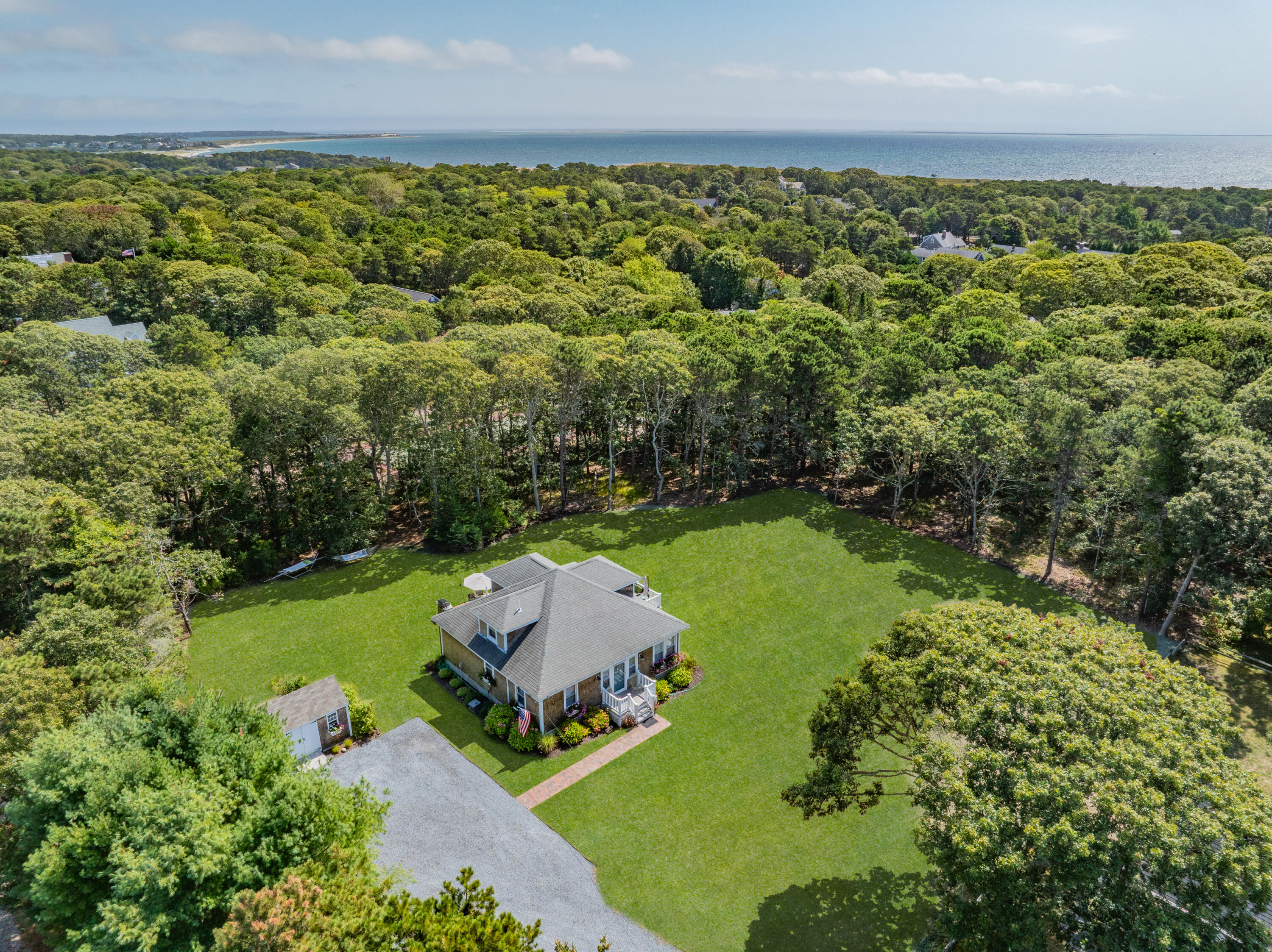 79 Forest Beach Road South Chatham, MA 02659 - Photo 5 of 60 an aerial view of a house with a yard