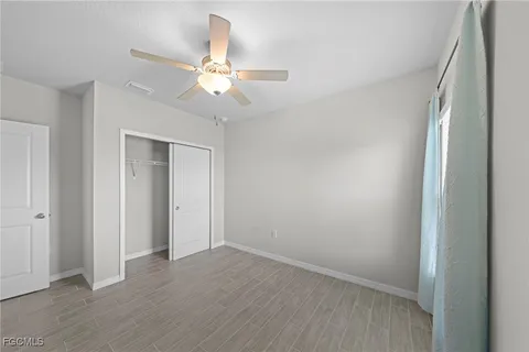 a view of a building with traffic signal lights