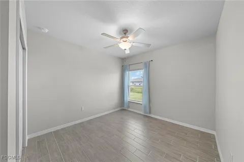 a view of a lake with a city skyline in the background