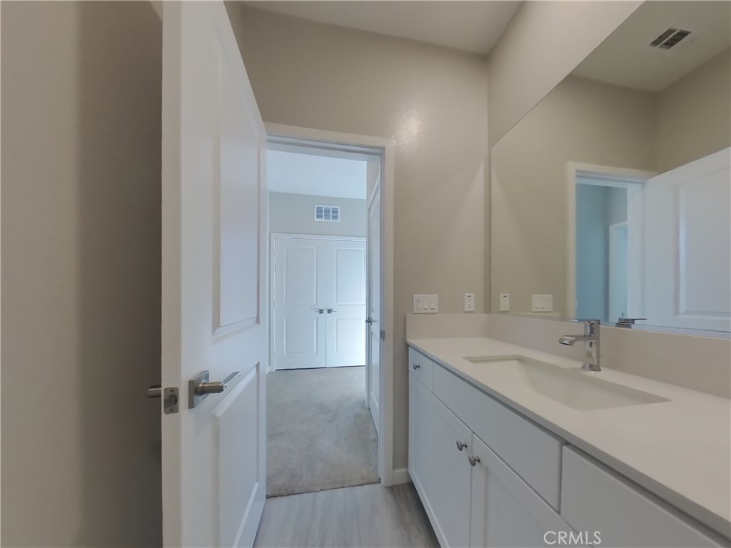 24967 Padre Court Wildomar, CA 92595 - Photo 14 of 30 a bathroom with a sink and a mirror
